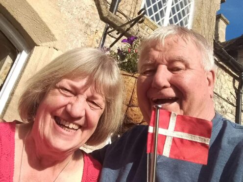 England supporter Michael Wild and his Danish wife, Joan, watched England face Denmark in Euro 2024 (Michael Wild/PA)