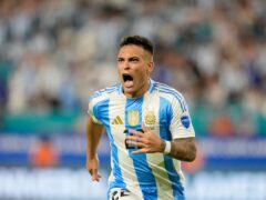 Argentina’s Lautaro Martínez celebrates scoring his side’s opening goal against Peru (Lynne Sladky/AP)