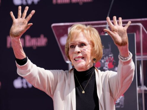 Comedian Carol Burnett holds up her hands after putting them in cement during a ceremony for her at the TCL Chinese Theatre AP Photo/Chris Pizzello)