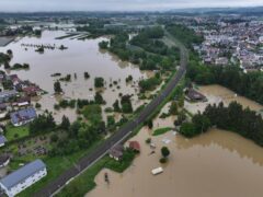 Flooding, high river levels and heavy rain led to the death of a firefighter and disrupted train travel in southern Germany on Sunday (Felix Kästle/dpa/AP)