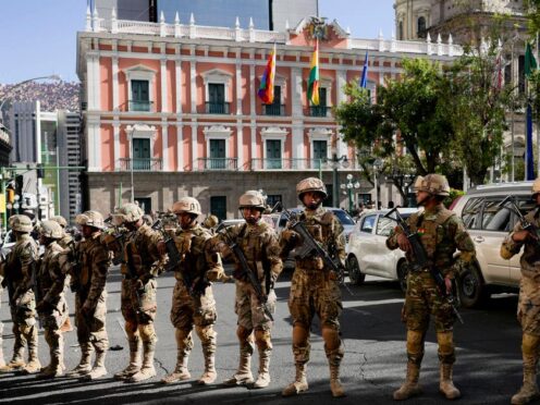 Soldiers stand guard outside the presidential palace in Plaza Murillo in La Paz, Bolivia (Juan Karita/AP)