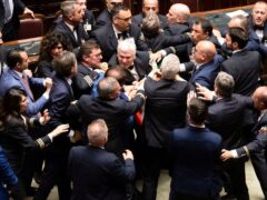 Tensions over an Italian government proposal that opponents say will further impoverish the poorer south erupted into a fistfight in which opposition politician Leonardo Donno was injured (Mauro Scrobogna/LaPresse/AP)