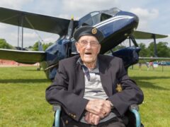 Second World War veteran Arthur Clark’s care home surprised him with a flight in a 1930s plane (Care UK/PA)