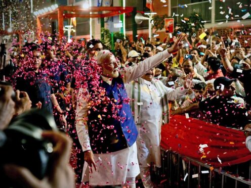Prime Minister Narendra Modi is greeted by supporters (Manish Swarup/AP)