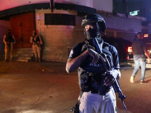 Police guard outside the hospital where Haiti’s newly selected prime minister Garry Conille was treated in Port-au-Prince (Odelyn Joseph/AP)