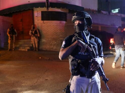 Police stand guard outside a hospital in Haiti (Odelyn Joseph/AP)