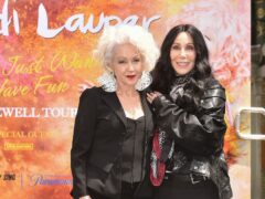 Cyndi Lauper and Cher pose during a hand and footprint ceremony honouring Lauper (Richard Shotwell/Invision/AP)