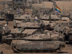 Israeli soldiers stand on top of tanks in a staging area near the Israeli-Gaza border in southern Israel, Monday, June 3, 2024. (Leo Correa/AP)