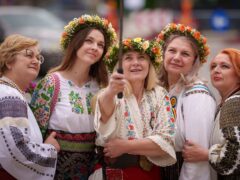 Women wearing Romanian traditional blouses (Vadim Ghirda/AP)
