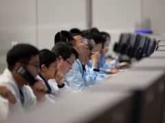 Technical personnel work at the Beijing Aerospace Control Centre in Beijing on Sunday (Xinhua News Agency/AP)