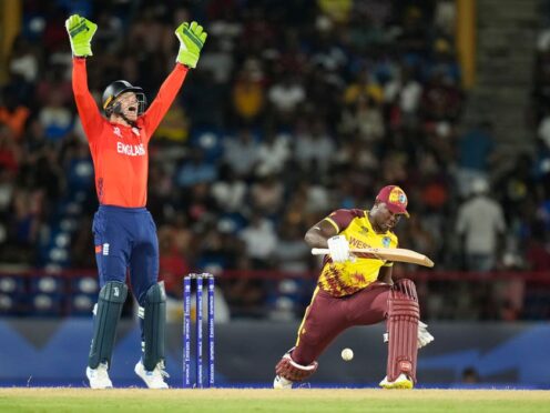 England’s captain Jos Buttler, left, appeals for the wicket of West Indies’ captain Rovman Powell (Ramon Espinosa/AP)