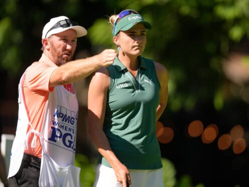 Lexi Thompson talks with her caddie on the 12th tee (Gerald Herbert/AP)