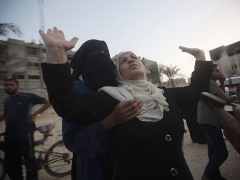 Palestinian women mourn loved ones killed by an Israeli bombardment, during their funeral in Khan Younis, southern Gaza Strip, on Friday (Jehad Alshrafi/AP)
