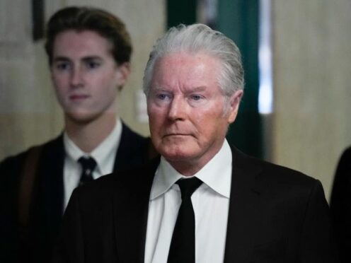 Musician Don Henley, right, arrives at court in New York for an earlier hearing (Seth Wenig/AP)