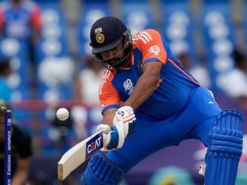 India’s captain Rohit Sharma plays a shot against Australia (Ramon Espinosa/AP)