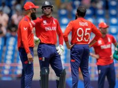 Jos Buttler, second left, admitted England fell short with the bat (AP Photo/Ramon Espinosa)