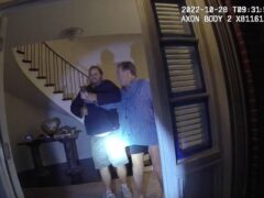 In this image taken from San Francisco police department body camera video, the husband of former US house speaker Nancy Pelosi, Paul Pelosi, right, fights for control of a hammer with his assailant, David DePape, during a brutal attack in the couple’s San Francisco home (San Francisco Police Department via AP, File)