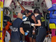 Some of the 11 migrants saved from the sea after their sailboat sank in the Mediterranean Sea between Italy and Greece (Valeria Ferraro/AP)