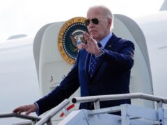 President Joe Biden waves as he arrives on Air Force One at Westchester County Airport in White Plains, New York, on Monday (Alex Brandon/AP)