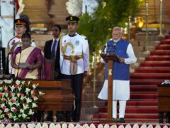 Narendra Modi, right, is sworn-in as the prime minister of India by President Draupadi Murmu, left, at the Rashtrapati Bhawan, in New Delhi, India (Manish Swarup/AP)
