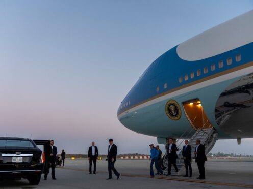US President Joe Biden walks to his limousine as he arrives on Air Force One in Los Angeles (Alex Brandon/AP)