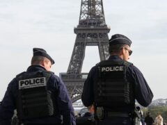 Police officers patrol the Trocadero plaza after three men were questioned on suspicion of perpetrating ‘psychological violence’ after they allegedly placed five coffins at the foot of the Eiffel Tower (Michel Euler/AP)