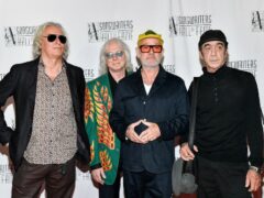 Peter Buck, Mike Mills, Michael Stipe and Bill Berry performed at the event (Invision/AP)