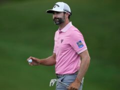 Adam Hadwin gestures after putting on the 18th green in the first round of the Memorial golf tournament (Sue Ogrocki/AP)