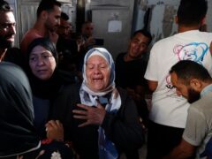 Palestinians mourn their relatives who were killed in the Israeli bombardment of the Gaza Strip (AP)