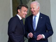 President Joe Biden smiles with French President Emmanuel Macron (Michel Euler/AP)