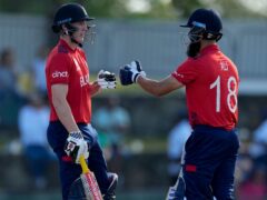 England’s Harry Brook and Moeen Ali helped the holders to victory over Namibia (Ricardo Mazalan/AP)