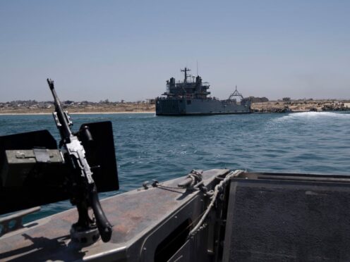 A US army vessel is moored at the US-built floating pier that connects to the beach on the coast of the Gaza Strip (Leo Correa/AP)