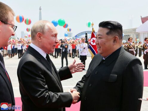 Russian President Vladimir Putin and North Korea’s leader Kim Jong Un shake hands during the official welcome ceremony in the Kim Il Sung Square in Pyongyang, North Korea (KCNA/AP)