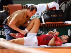 Novak Djokovic is out of the French Open with a knee injury (Jean-Francois Badias/AP)