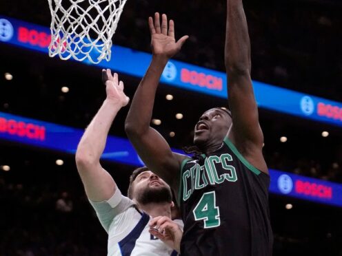 Boston Celtics guard Jrue Holiday shoots over Dallas Mavericks forward Maxi Kleber (Steven Senne/AP)