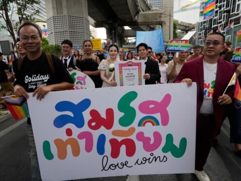 Protesters hold posters celebrating equality in marriage during a Pride Parade in Bangkok in June (AP Photo/Sakchai Lalit, File)