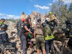 Emergency workers in Ukraine clear the rubble as they search for victims after a Russian missile hit Kryvyi Rih (Ukrainian Emergency Service via AP)