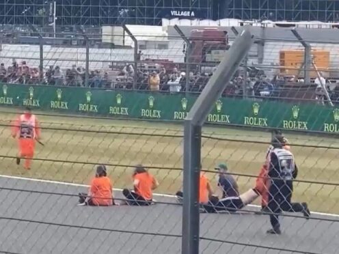 Climate change protesters during the track invasion at the 2022 British Grand Prix (Northamptonshire Police/PA)