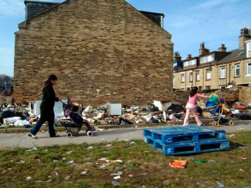 The study suggests the cap has driven up the share of children in large families who are in relative poverty (Alamy/PA)