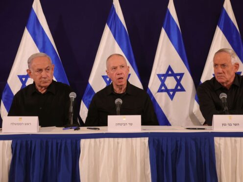 Israeli Prime Minister Benjamin Netanyahu, defence minister Yoav Gallant and cabinet minister Benny Gantz speak during a news conference in the Kirya military base in Tel Aviv, Israel (Abir Sultan/AP)