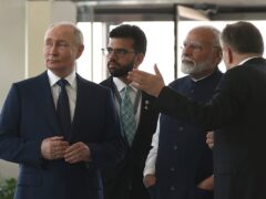 Russian President Vladimir Putin and Indian Prime Minister Narendra Modi shake hands (Alexander Nemenov/Pool Photo via AP)