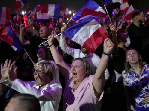 Supporters of French far right leader Marine Le Pen cheer (Thibault Camus/AP)