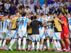 Players of Argentina celebrate defeating Ecuador in a penalty shootout (Julio Cortez/AP)
