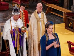 Lord President of the Council, Penny Mordaunt, holding the Sword of State walking ahead of King Charles III during his coronation ceremony in Westminster Abbey (Yui Mok/PA)