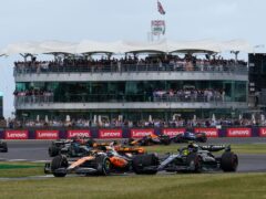 McLaren’s Lando Norris leads Mercedes’ Lewis Hamilton around Luffield in the 2023 British Grand Prix (David Davies/PA)