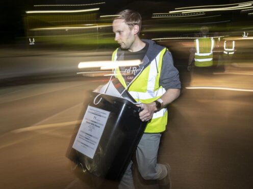 Ballot boxes arrive at an election count at an earlier election (PA)