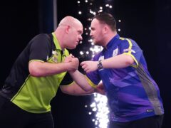 One of Michael van Gerwen and Luke Littler will exit Blackpool in the first round (Mike Egerton/PA)