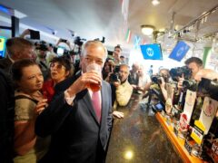 Leader of Reform UK Nigel Farage enjoys a pint of beer as he launches his General Election campaign in Clacton-on-Sea, Essex on June 4 (James Manning/PA)