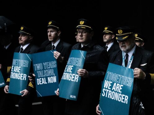 Aer Lingus pilots march around Dublin Airport as they begin their eight-hour strike on Saturday in a bitter dispute with the airline over pay (Evan Treacy/PA)