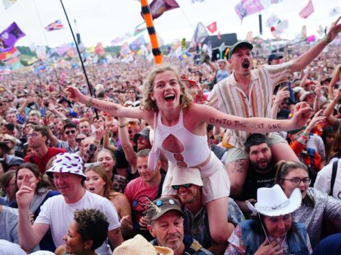 Crowds watch Avril Lavigne performing on The Other Stage (Ben Birchall/PA)
